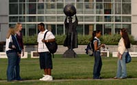 Students near Citizen Scholar statue